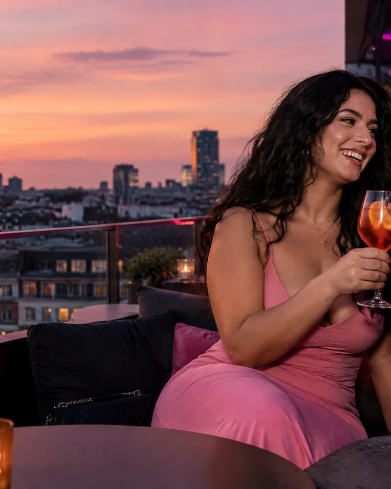 AI-generated image: two friends toasting at a rooftop bar